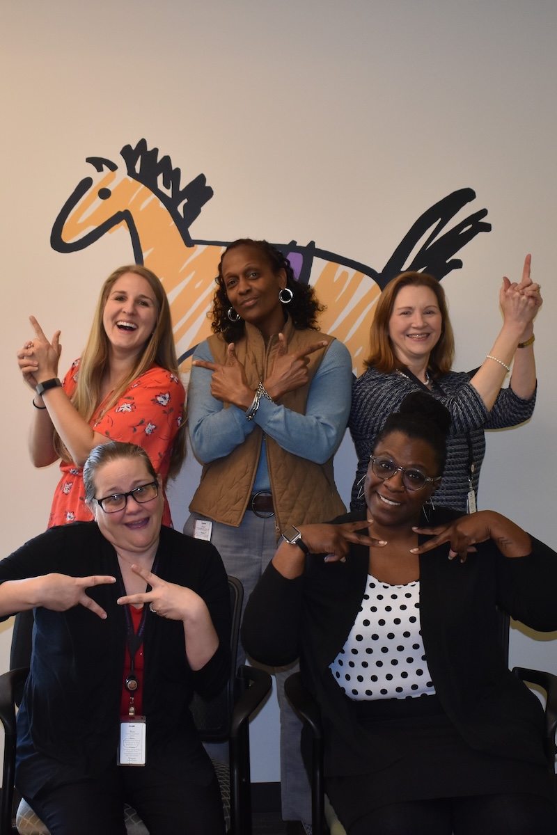 Rocking Horse staff smiling for a photo on the careers page