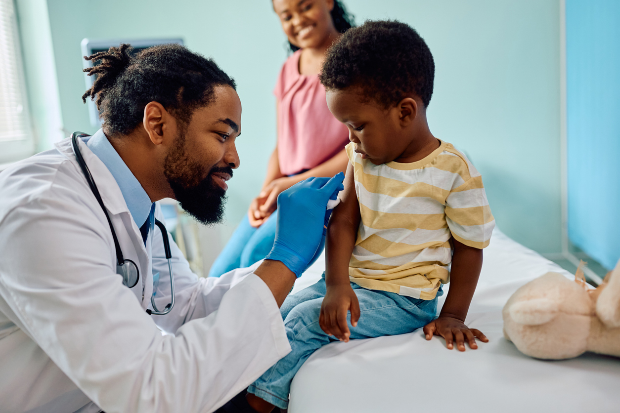 Doctor providing a pediatric patient with a vaccine